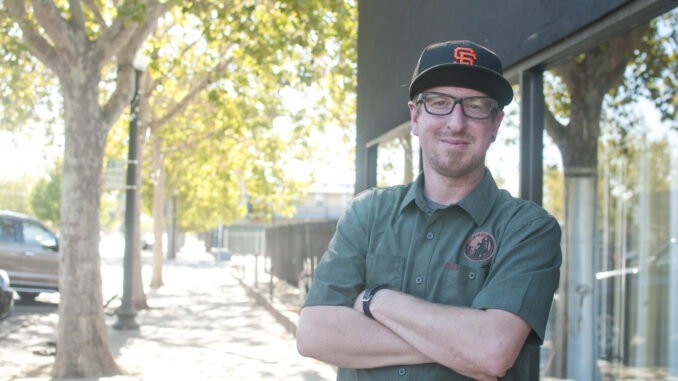 Jonathan Tate stands in front of King Cong Brewing on Del Paso Boulevard.