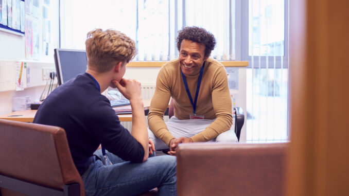 Two men talking in an office