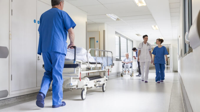 Health care workers in a corridor