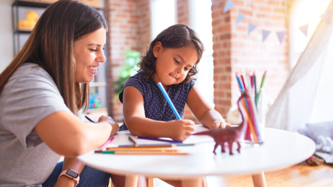 a teacher and child at kindergarten