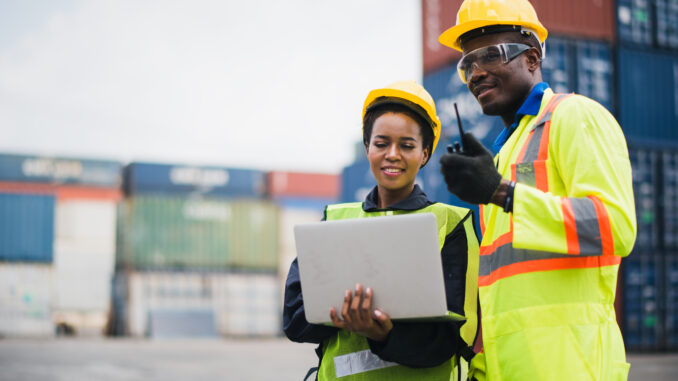 Two people working in the construction trades.