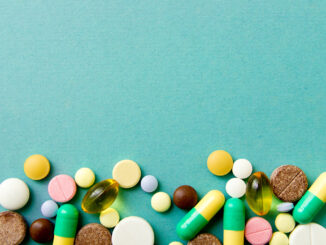 Decorative image of several different types of medications on a light blue background