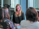 A photo of Tina Atherall speaking with clients