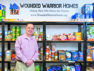 Portrait of Marine Corps veteran Rick Espitia at the food pantry of the Wounded Warrior Homes offices. Rick is the President/Chairman of the organization