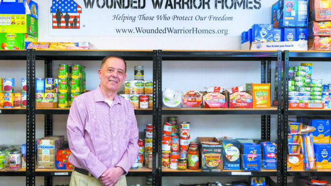 Portrait of Marine Corps veteran Rick Espitia at the food pantry of the Wounded Warrior Homes offices. Rick is the President/Chairman of the organization