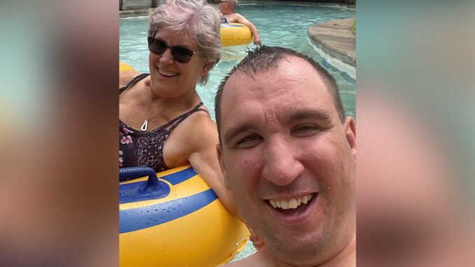 A selfie of Dan McCullough and his mother Nancy in a swimming pool