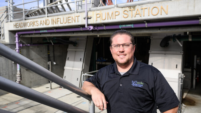 Anthony Canevaro standing in front of a pump station at a water treatment plant