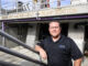 Anthony Canevaro standing in front of a pump station at a water treatment plant