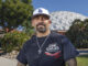 Portrait of formerly incarcerated Jose Romero at Palomar College where he partipates in the Rising Scholars program. He’s also a student at Calfornia State University San Marcos. In the background is the school’s longtime landmark dome that houses the gymnasium.