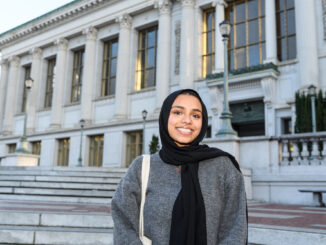 Aneesa Mustafa standing outside and smiling for the camera