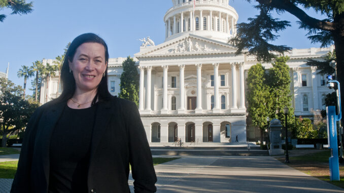 Darcy Totten in front of the Capitol building in Sacramento