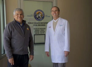 Dr. Henning Ansorg and Brian Cabrera smiling for the camera