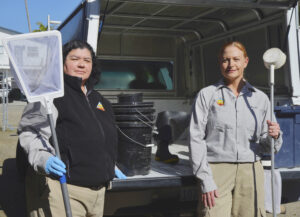 Karen and Vesna standing with mosquito and pest control tools