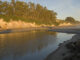 Still water in the Goleta Slough along the California Coast reflecting the water afternoon light
