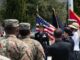 Erica Courtney in dress uniform speaking to uniformed service members