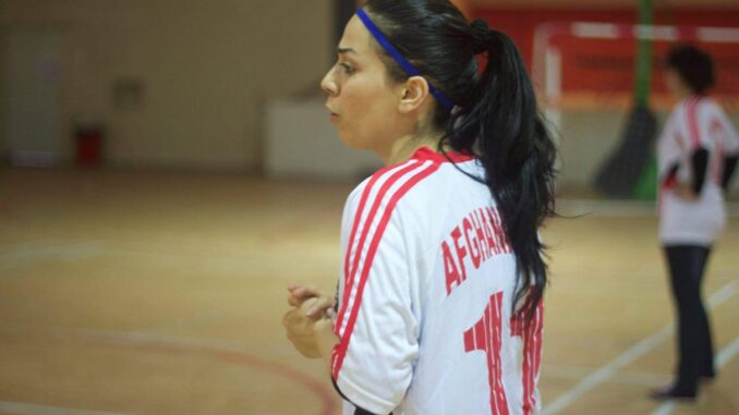 CCSWG_S6_Women in Sports_Kawser Amine_03 Kawser Amine in uniform on a court